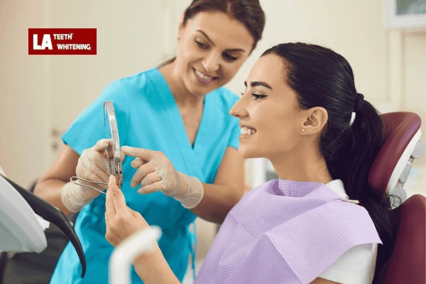 Person looking in a mirror, symbolizing the importance of realistic whitening goals Corby